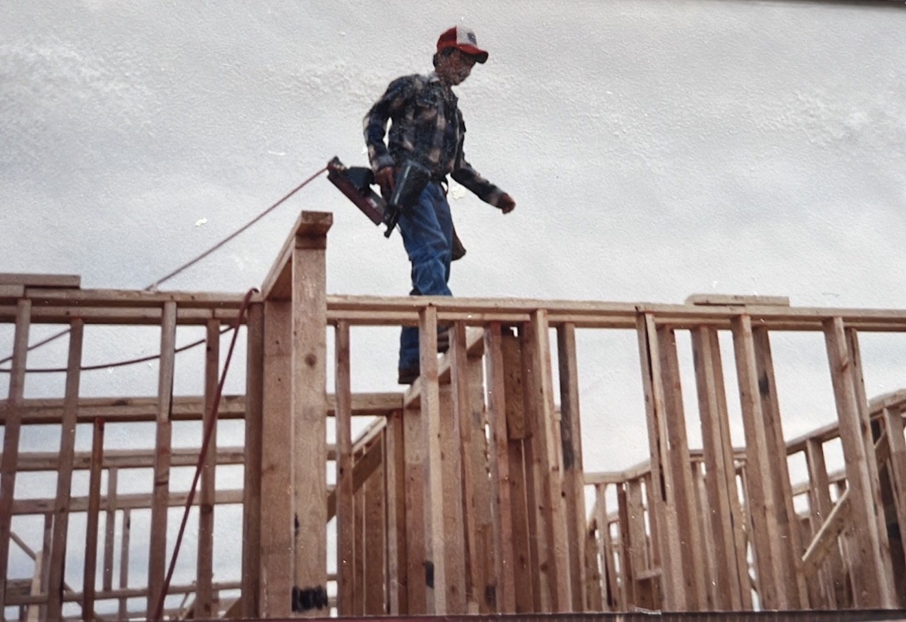Strong Framing carpenter framing a wall in the early days