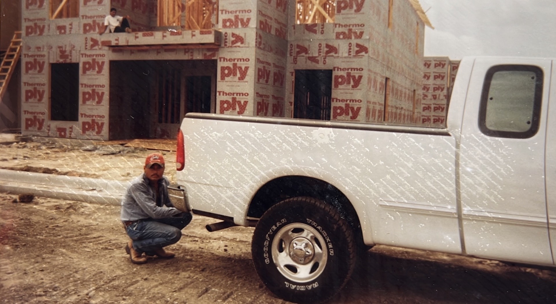Strong Framing founder on an early job site with work truck
